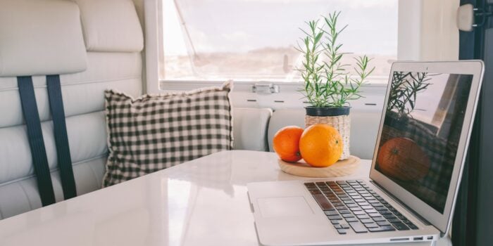 laptop in RV - feature image for seasonal jobs for full time RVers
