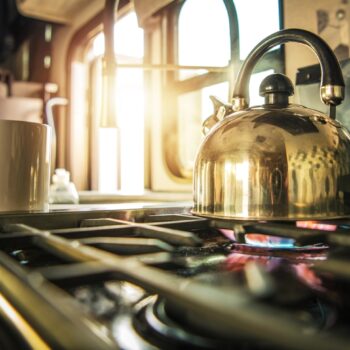 Boiling Water in kettle on stove Inside RV Motorhome
