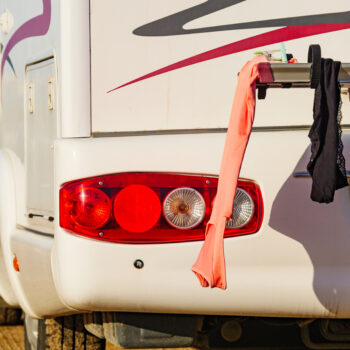clothes hanging from back of RV - feature image for dirty laundry solutions