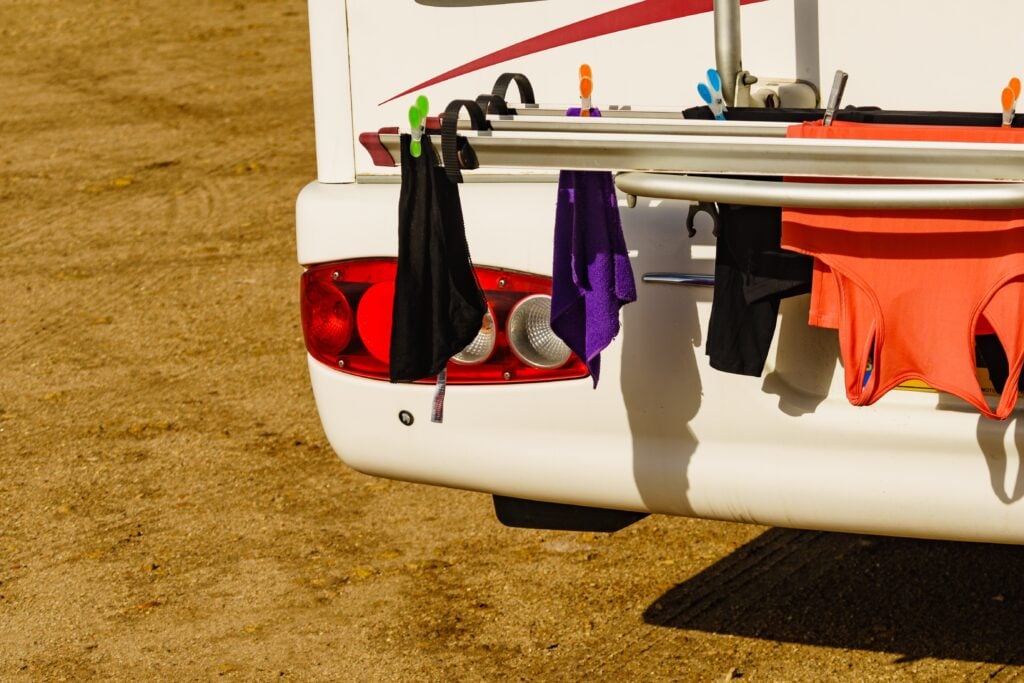 clothes hanging from back of RV - feature image for dirty laundry solutions