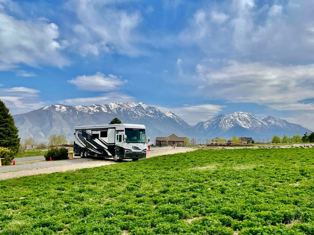 class a motorhome parked at a scenic harvest hosts location