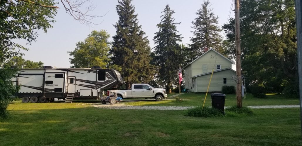 RV parked in front of farm house in Iowa