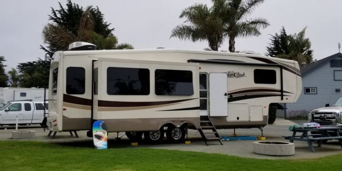 A fifth-wheel trailer in a campsite at Pismo Coast Village in California.