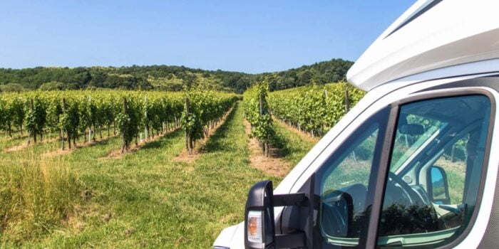 RV parked in front of vineyard
