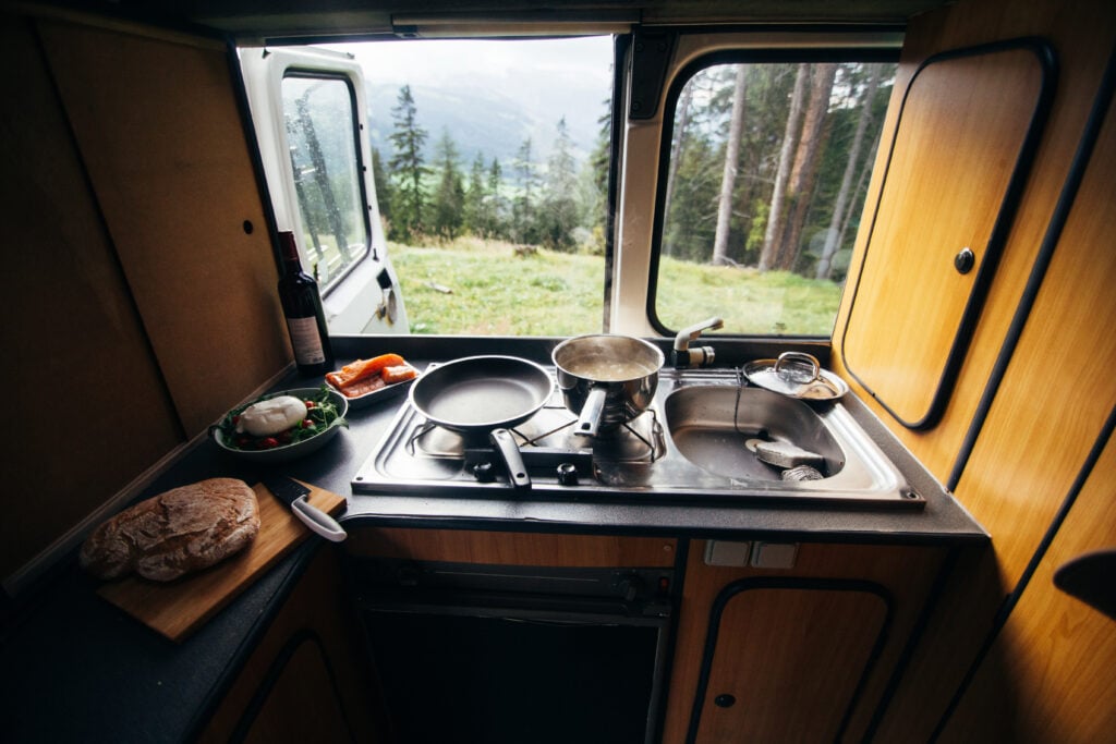 pots and pans in RV window - how to store pots and pans feature image