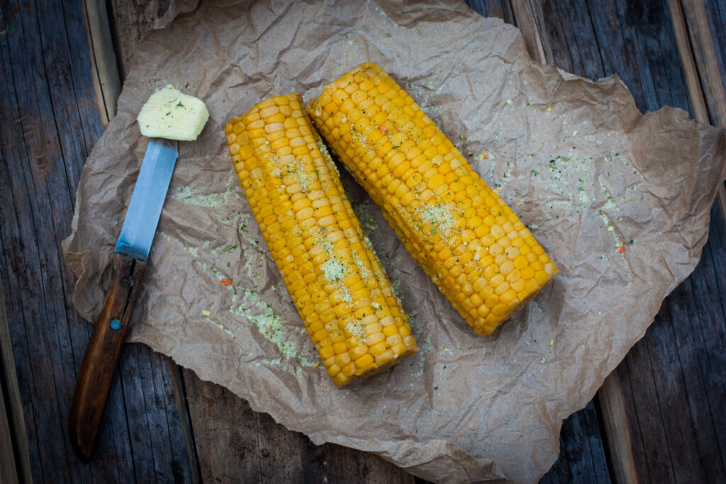 corn with butter, feature image for best way to cook corn on the cob
