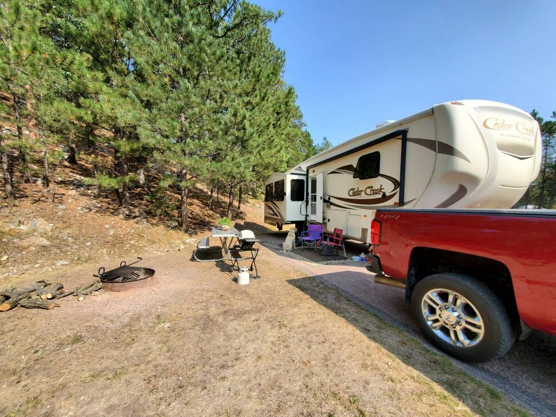 large fifth wheel set up in big rig friendly campsite with slide out extended