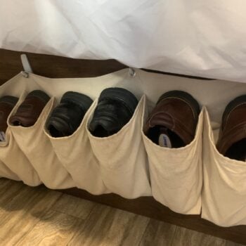 tan shoe storage on bed frame