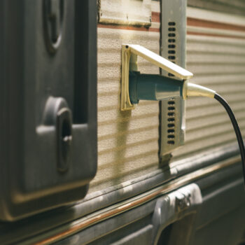 RV plugged in - feature image for can I leave my RV plugged in