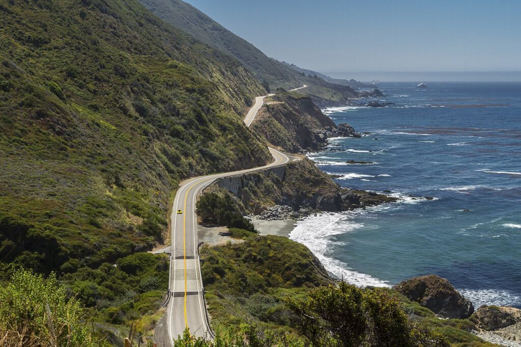 A car driving along the California coast
