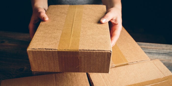 person opening box, feature image for how to get packages delivered