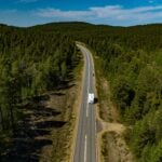 aerial view of RV on highway, feature image for scenic routes