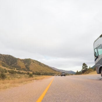 motorhome on road, featured image for dangerous mistakes for new RVers