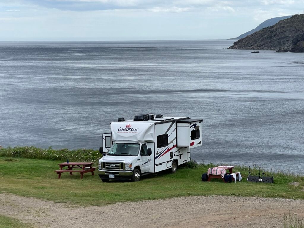 A Class C motorhome set up with a great view of the Ocean
