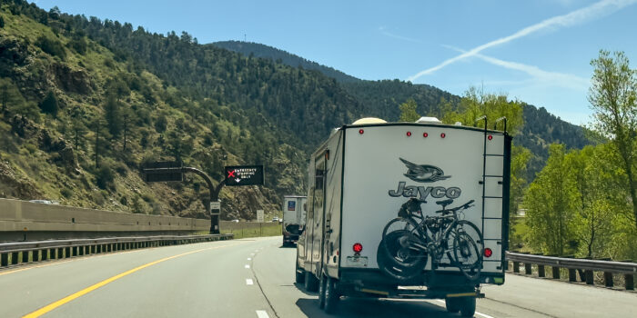 RV trailer on highway, image for RV snowbirds