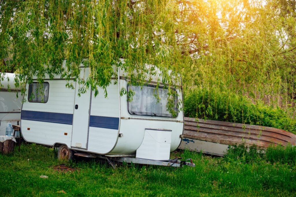 old travel trailer in backyard