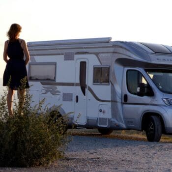 Lady admiring motorhome: motorhome insurance is necessary for protecting her asset