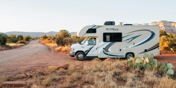 Class C parked in desert campsite, perfect for use when renting an RV