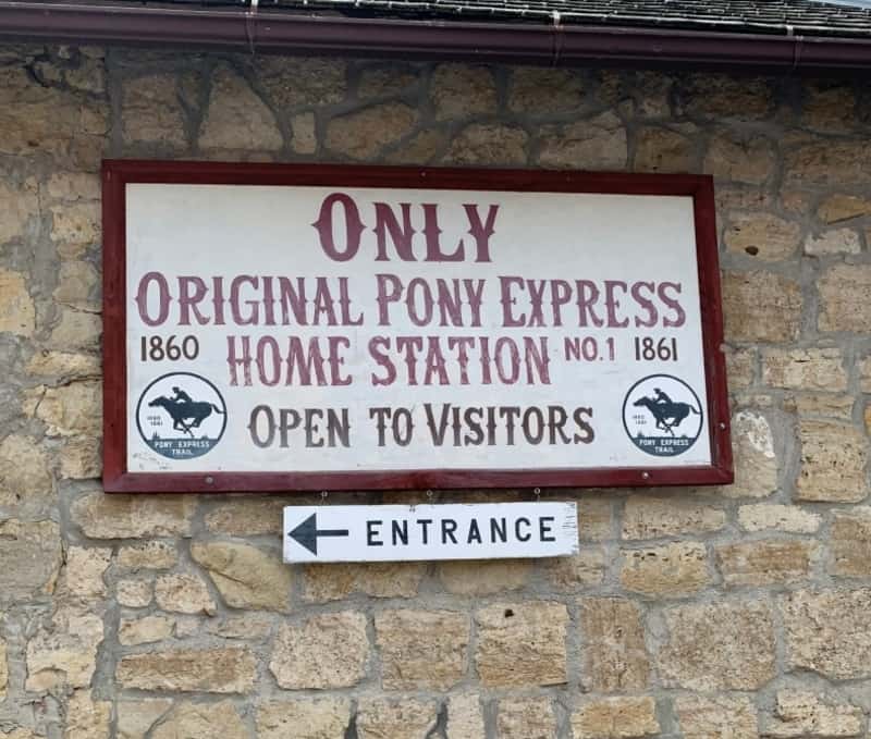 stone building with sign for original pony express station