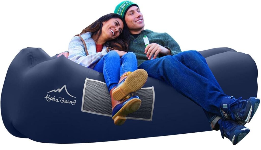 A couple sitting on an AlphaBeing Inflatable lounger. Photo courtesy Amazon.com.